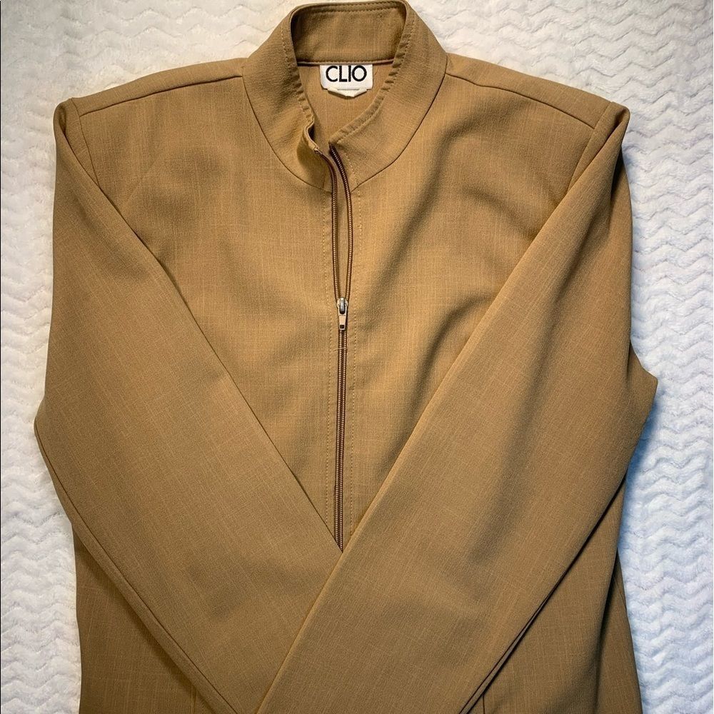 Clio women’s tan jacket with shoulder pads, size 8.